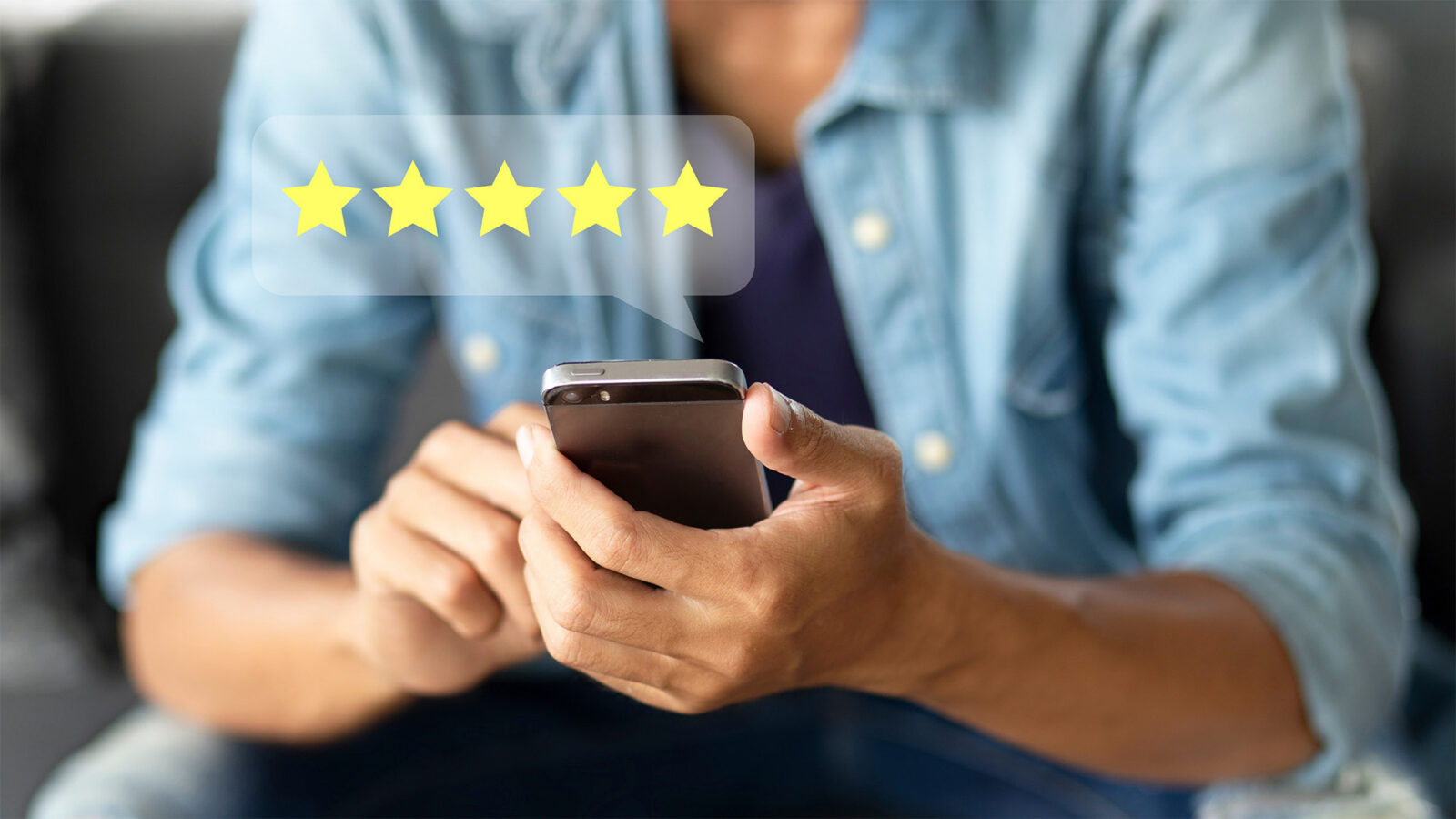 Customer pressing on smartphone with five star icon for feedback review satisfaction service