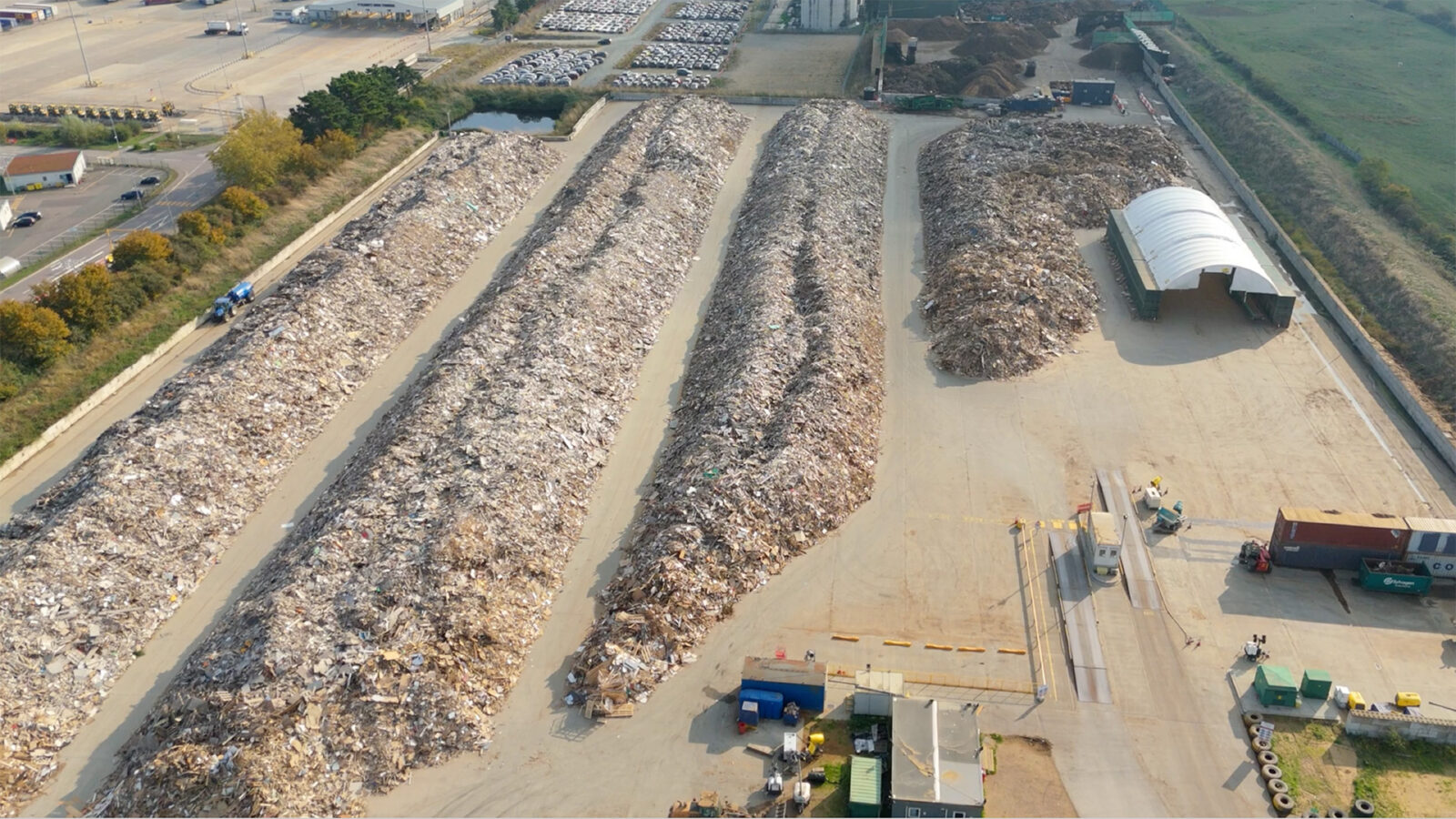 Aerial view of huge waste management facility, domestic refuse garbage recycling site for import export at Tilbury Docks, London UK.