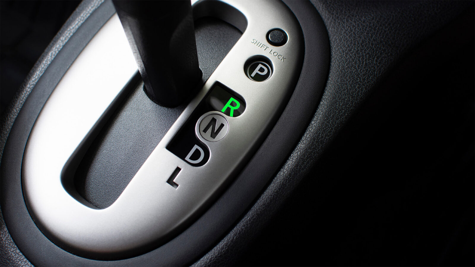 Put a gear stick into R position, (Reverse) Symbol in auto transmission car.